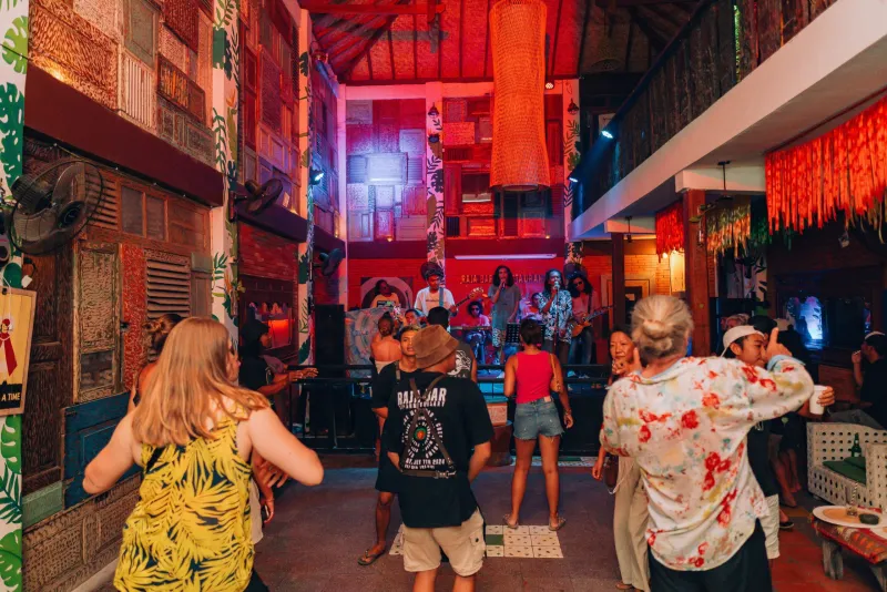 Live band and dancing crowd at Raja Bar at night